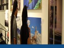 Photo of people viewing exhibit Lay of the Land, curated by Jarvis Grant